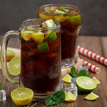 Beautiful cold drink of cola with Ice cubes